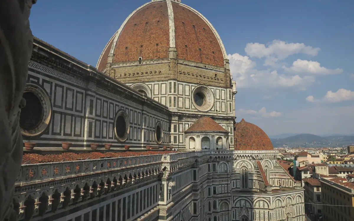 Florence Cathedral and its red-tiled dome above Piazza del Duomo rooftops.