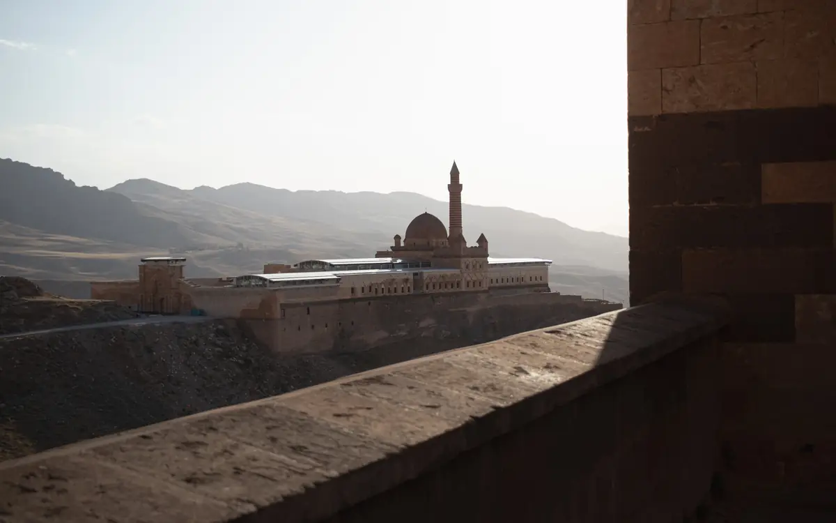 Ishak Pasha Palace below arid mountain ridges in eastern Turkey.