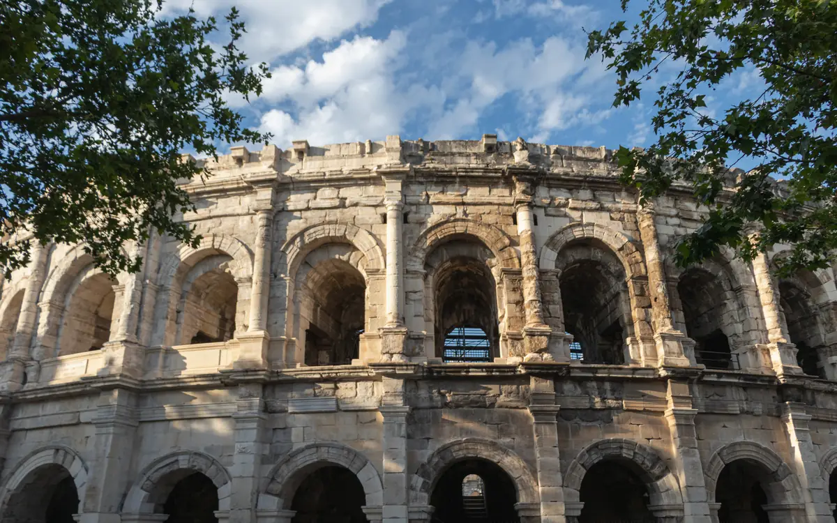 Stacked stone arches on the facade of the Amphitheatre of Nîmes.