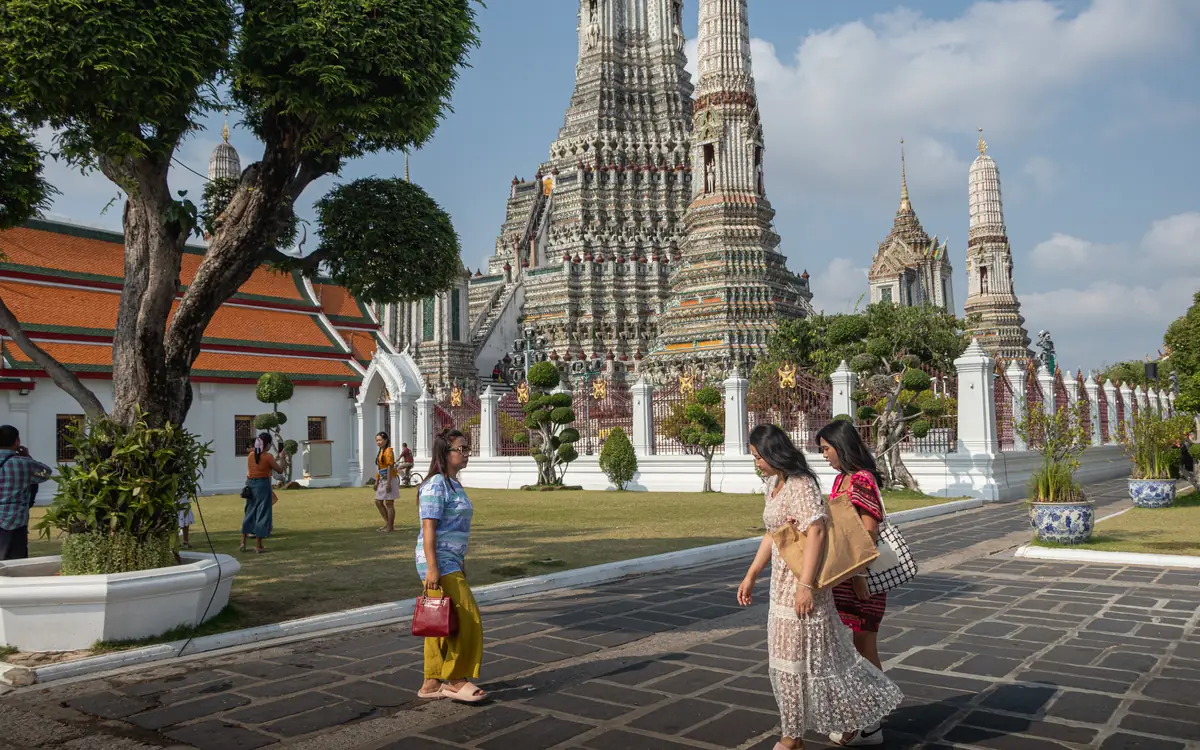 Thai temple courtyard with spires at Wat Arun.