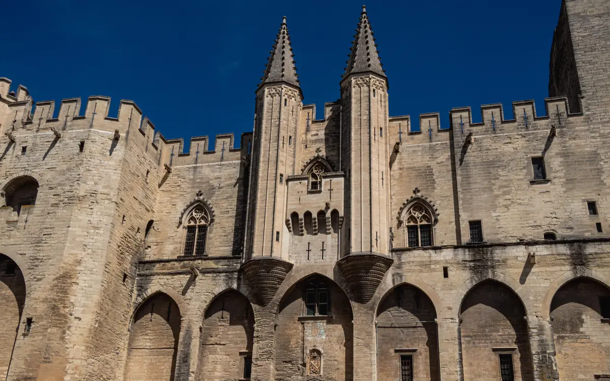 Medieval palace walls and towers at Palais des Papes.