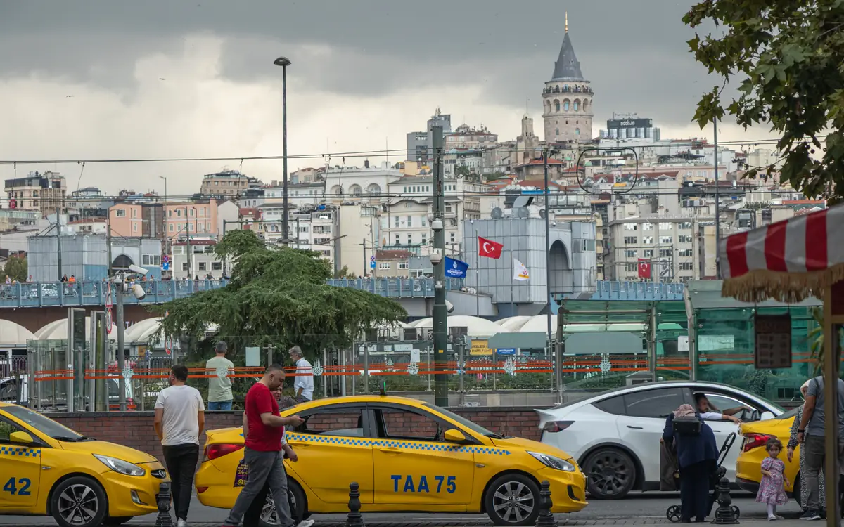 Istanbul street traffic with Galata Tower.