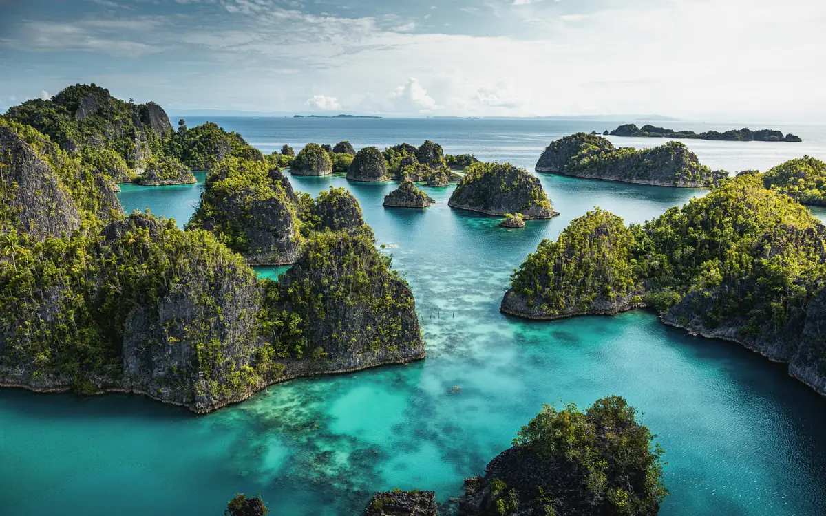 Karst islands and turquoise lagoons at Piaynemo.