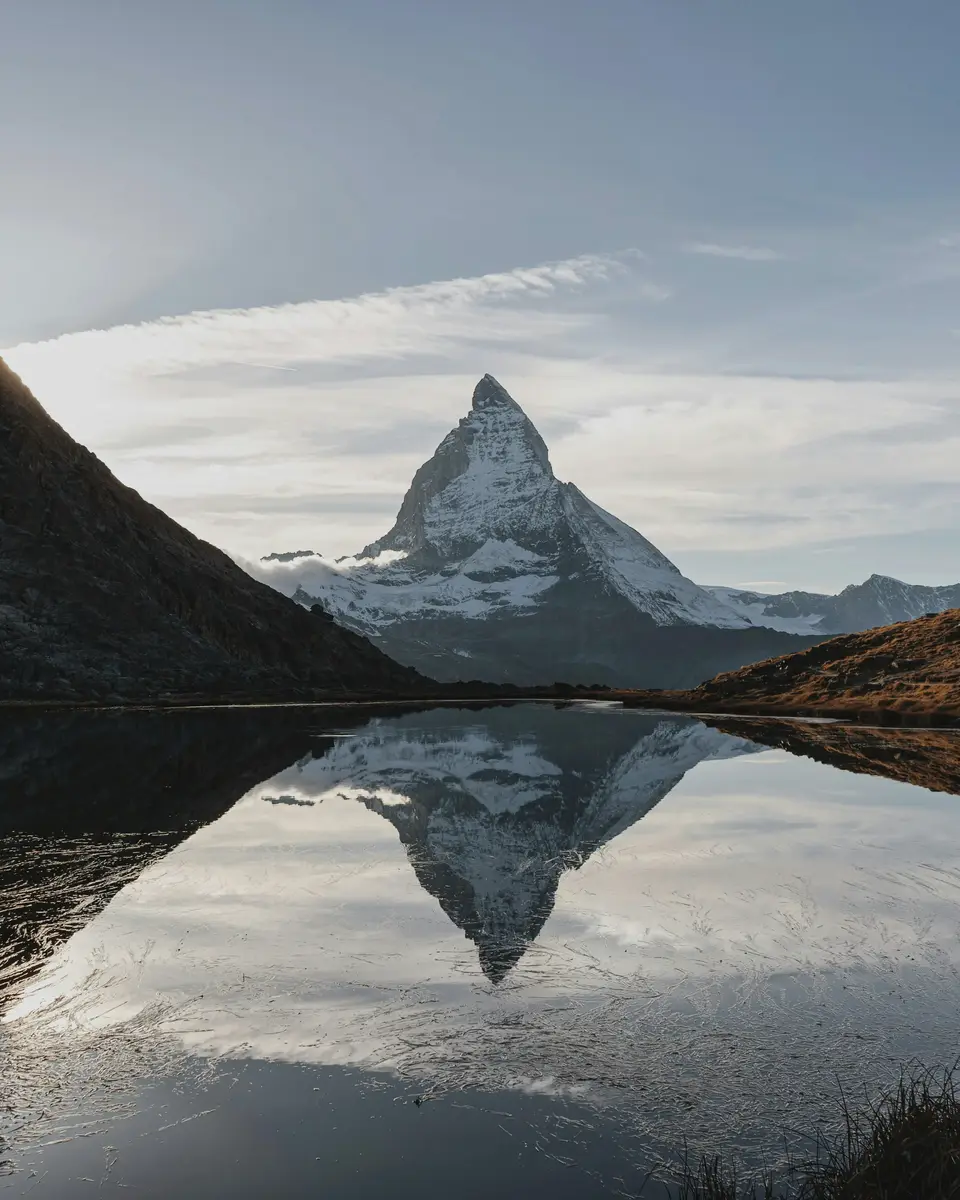 Photo of a mountain or valley landscape in Switzerland.