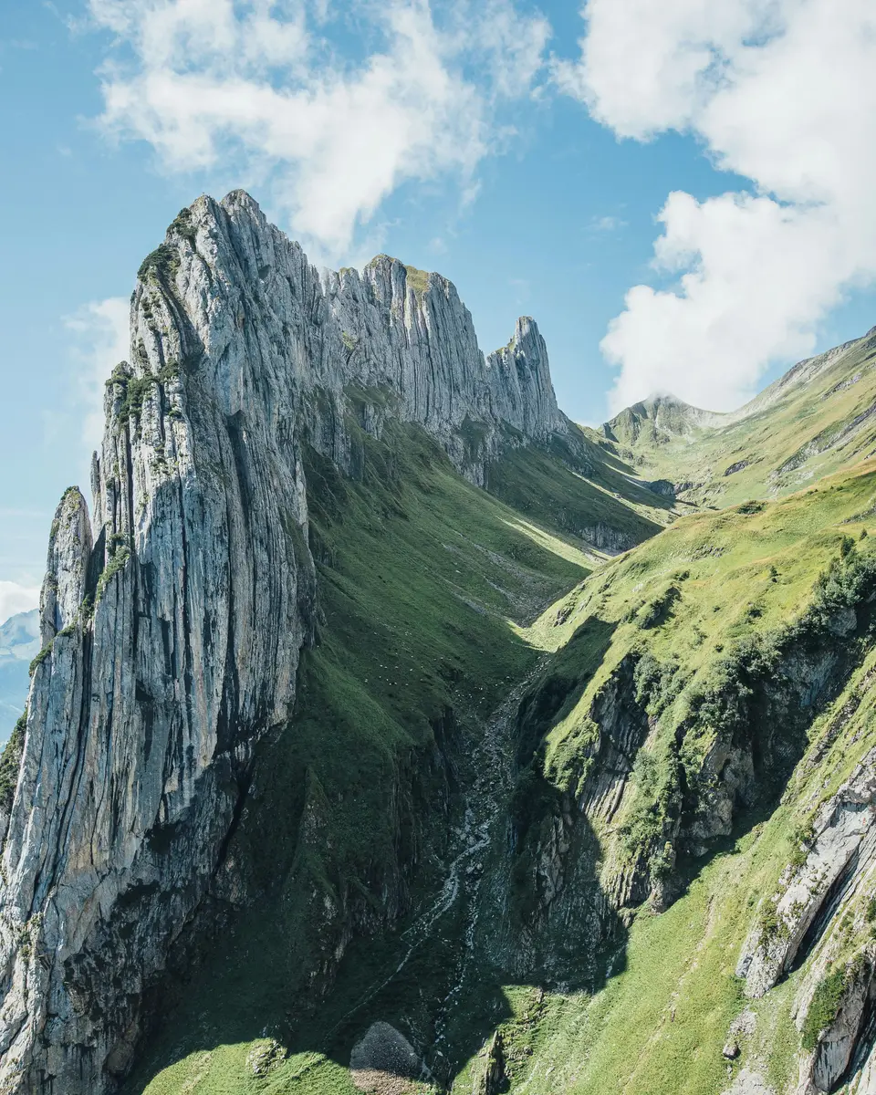 Photo of a mountain or valley landscape in Switzerland.